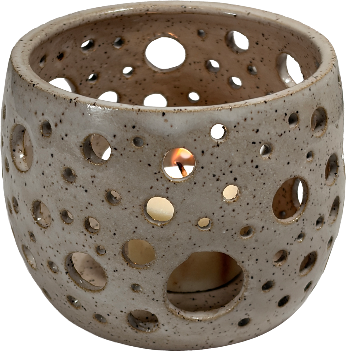 A ceramic candle holder with a speckled beige and gray glaze, featuring multiple circular cutouts that reveal a lit candle inside, set against a plain white background.