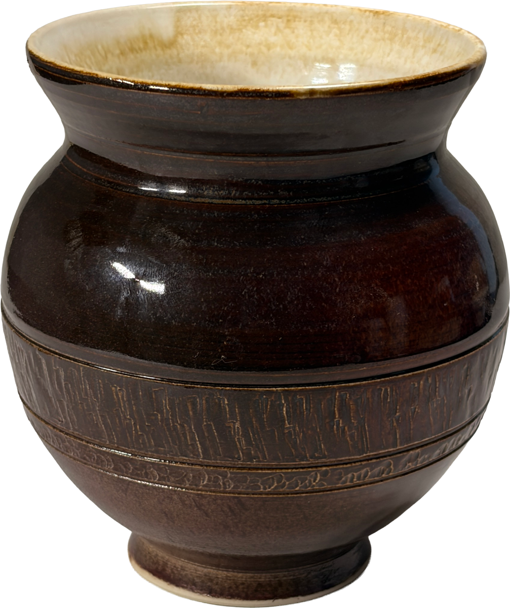 A dark brown glazed ceramic vase with a flared rim, featuring a textured band around the middle and a cream-colored interior glaze.